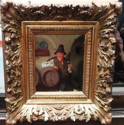 old-man-by-barrels-with-glass-of-red-wine